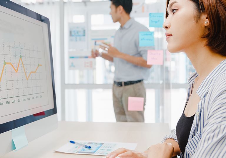 Woman looking at a line graph